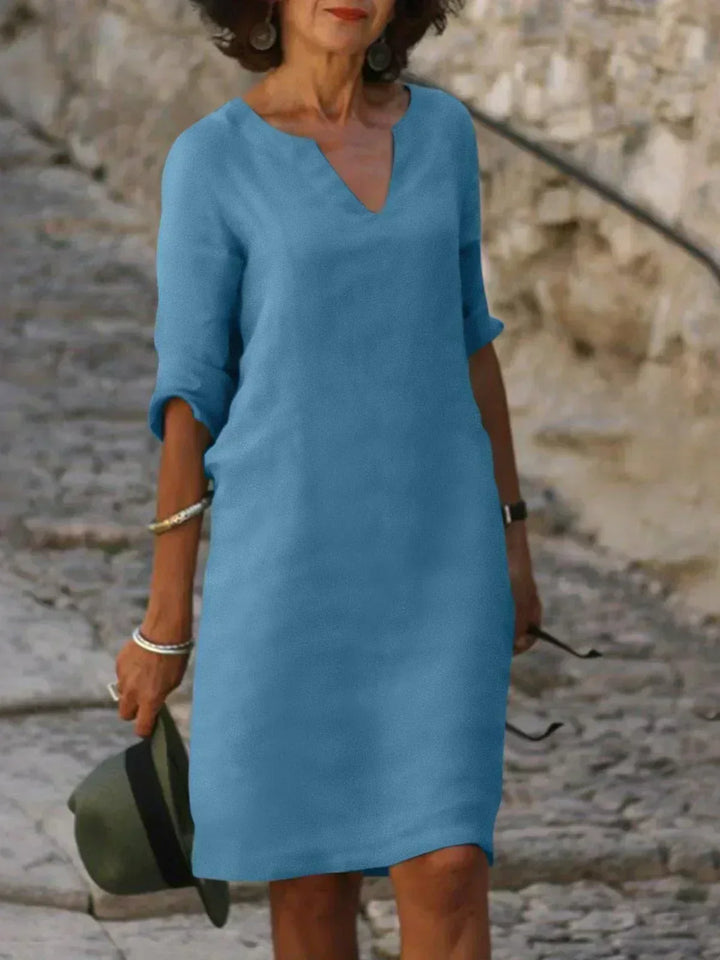 Emery – Elegant and refined dress that covers the belly