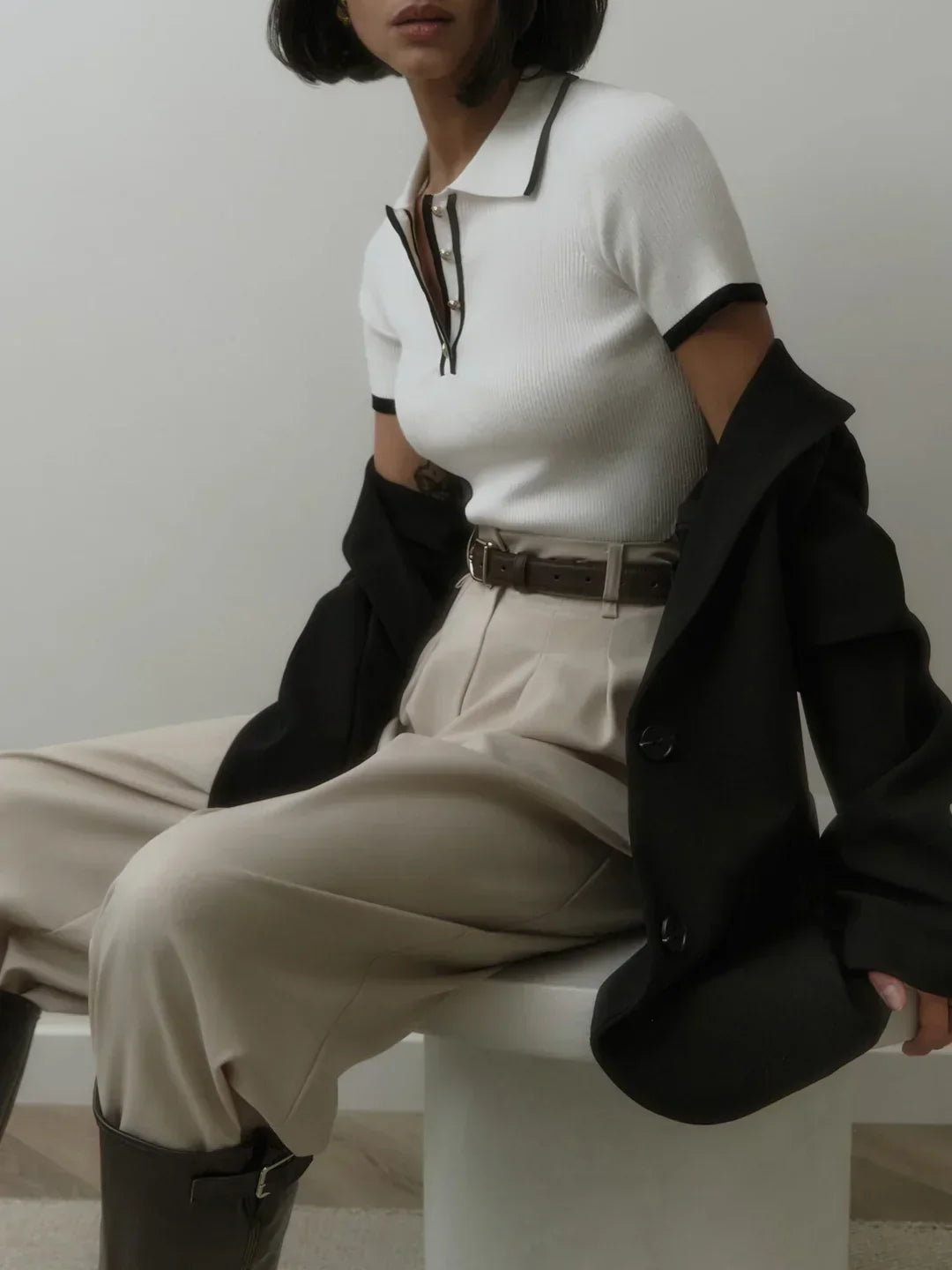 Knitted top with metallic buttons and contrasting details