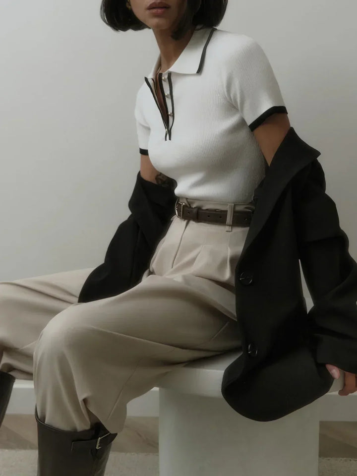 Knitted top with metallic buttons and contrasting details