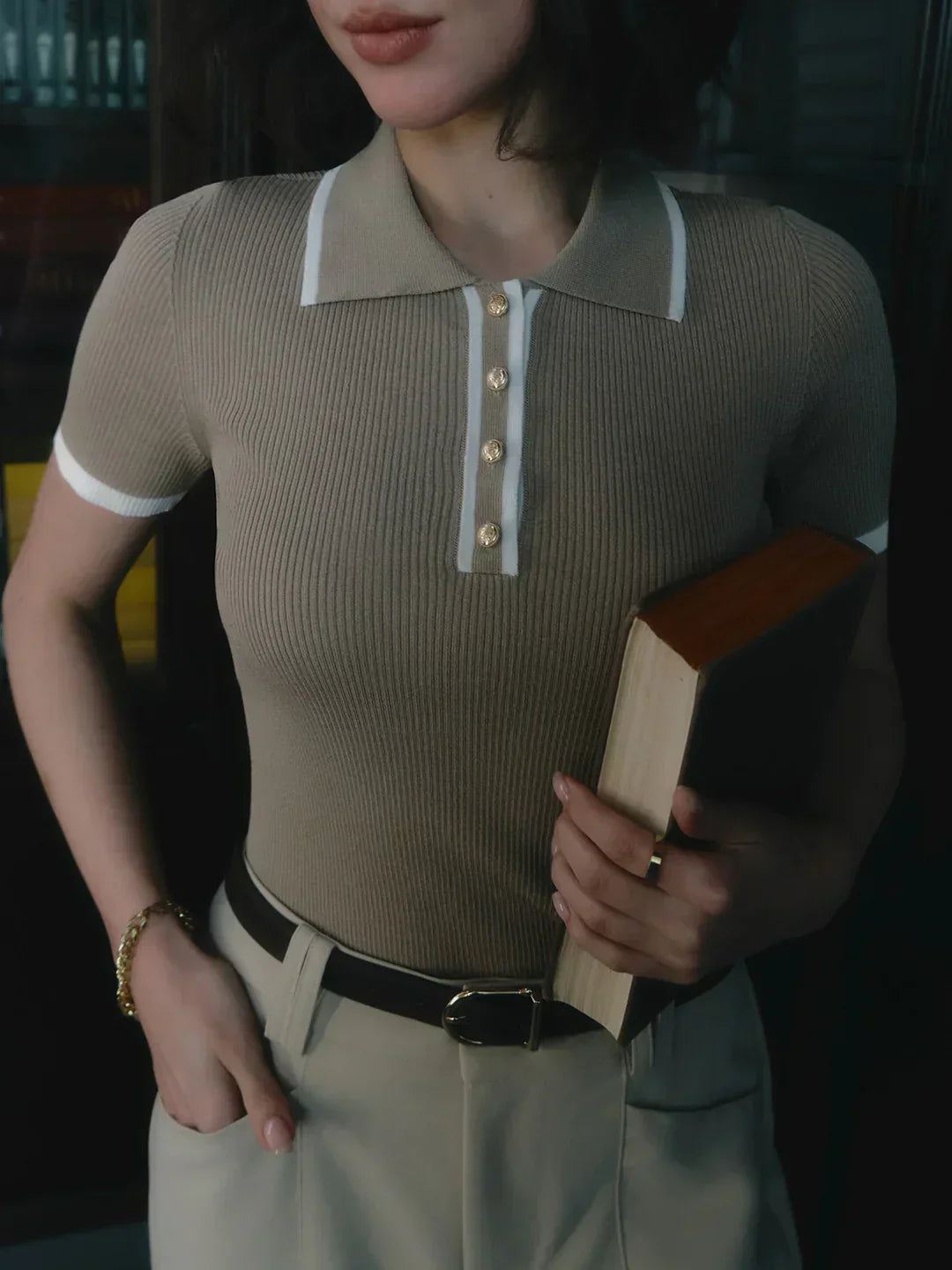 Knitted top with metallic buttons and contrasting details