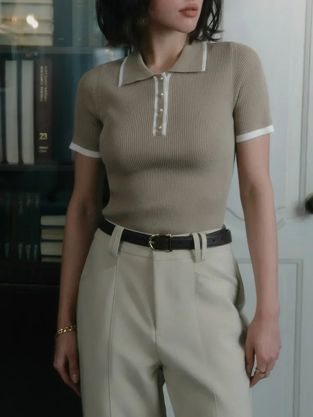 Knitted top with metallic buttons and contrasting details