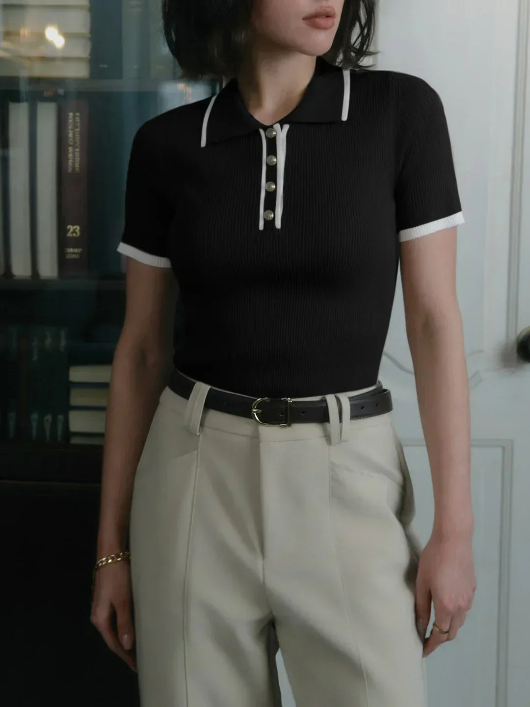 Knitted top with metallic buttons and contrasting details