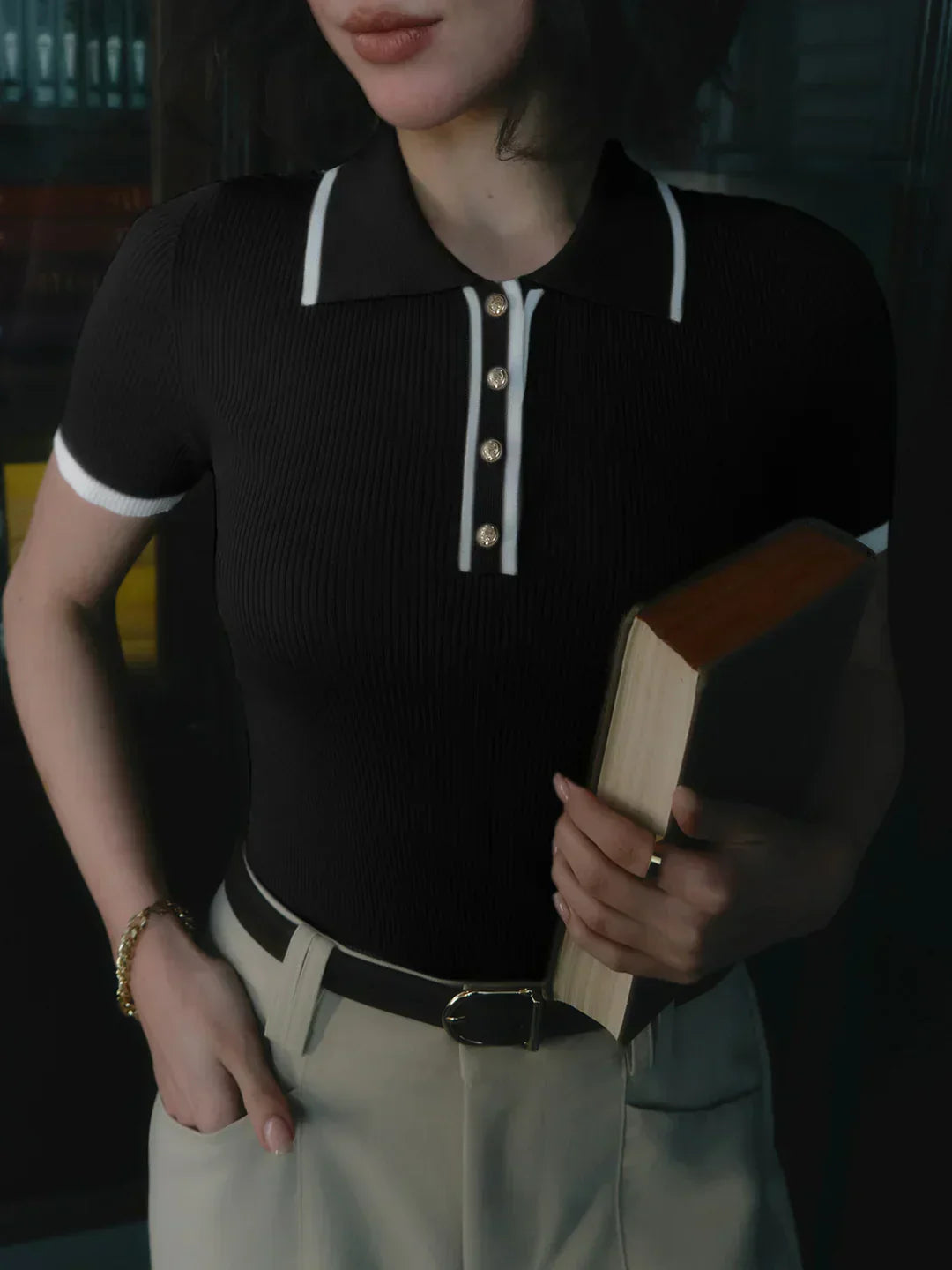 Knitted top with metallic buttons and contrasting details